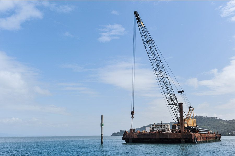 Marine Insurance - Floating barge with a large crane